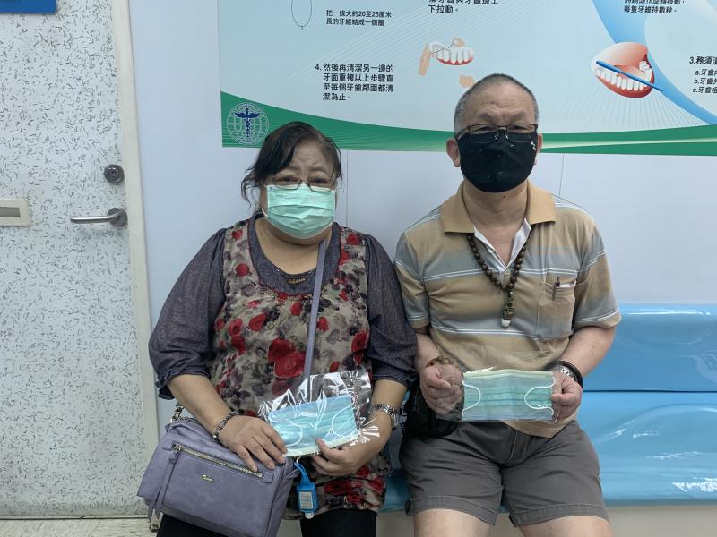 Giving out face masks to patients